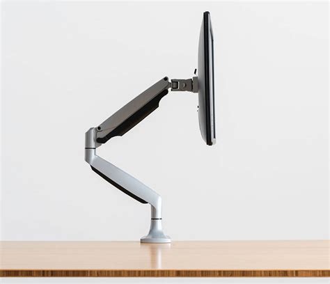 Im not sure if the table is too thin for the monitor weight since they can get pretty heavy (from 10 to 12 kg). . Jarvis monitor arm
